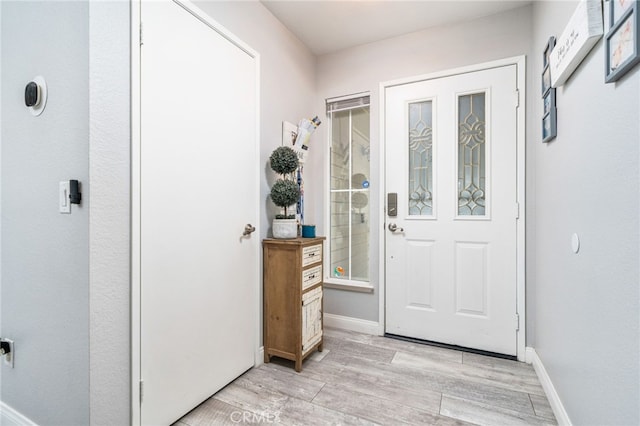 6932 Sundown Dr, Jurupa Valley, CA 92509 - foyer with light wood-type flooring and baseboards