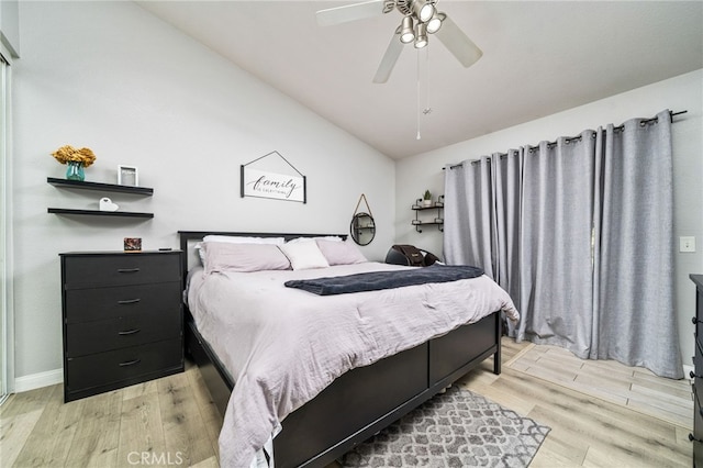 6932 Sundown Dr, Jurupa Valley, CA 92509 - bedroom featuring baseboards, ceiling fan, light wood finished floors, and vaulted ceiling