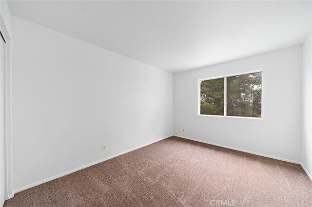 701 Black Oak Cir, Corona, CA 92881 - empty room featuring carpet floors and baseboards