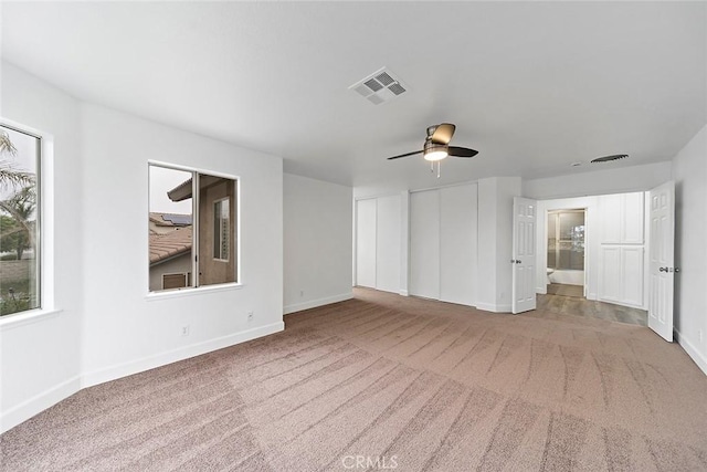 701 Black Oak Cir, Corona, CA 92881 - interior space with baseboards, carpet, two closets, and visible vents