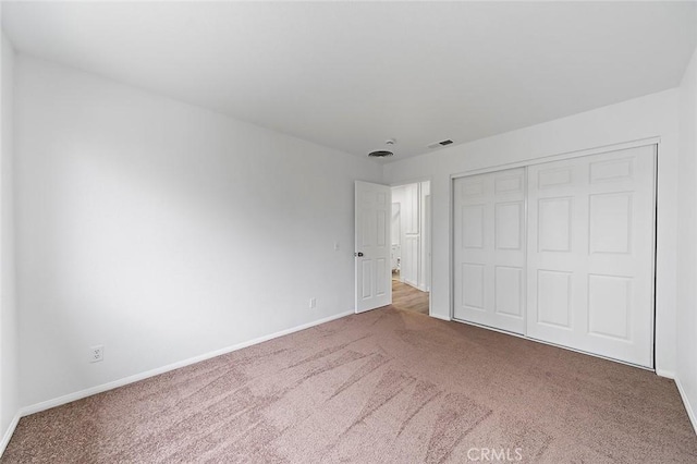 701 Black Oak Cir, Corona, CA 92881 - unfurnished bedroom with carpet floors, baseboards, and a closet