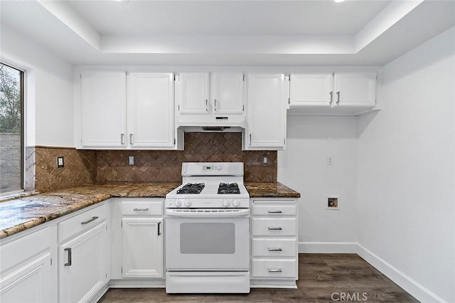 701 Black Oak Cir, Corona, CA 92881 - kitchen featuring under cabinet range hood, white cabinetry, white range with gas cooktop, and dark stone countertops