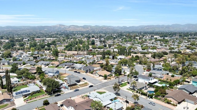 drone / aerial view featuring a residential view and a mountain view