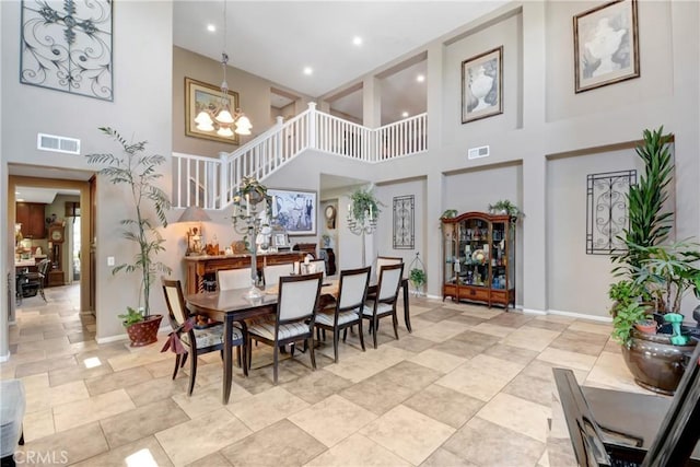 34440 Fawn Ridge Pl, Yucaipa, CA 92399 - dining room featuring a towering ceiling, baseboards, a chandelier, and recessed lighting