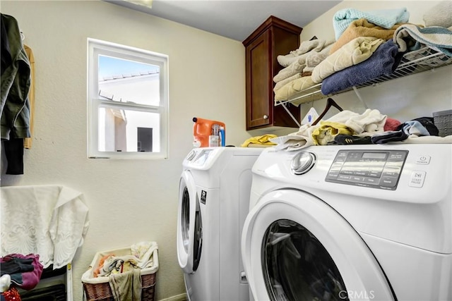 34440 Fawn Ridge Pl, Yucaipa, CA 92399 - laundry room featuring washing machine and clothes dryer and cabinet space