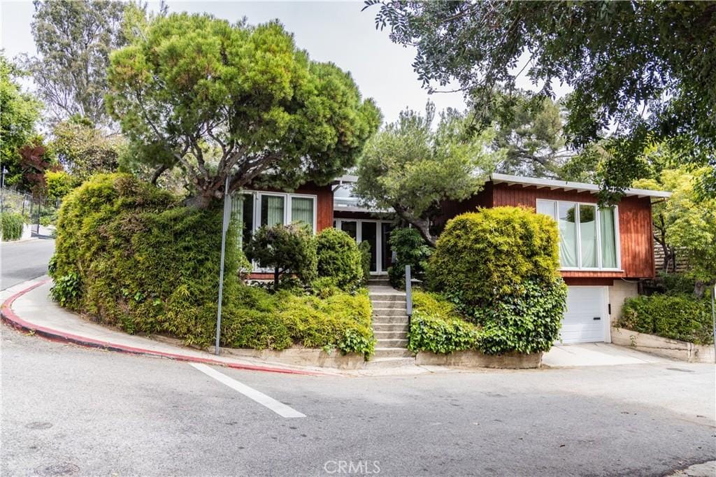 3288 Velma Dr, Los Angeles, CA 90068 - obstructed view of property with stairs and an attached garage