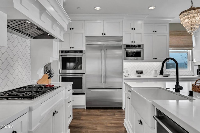 20752 Veneto Way, Porter Ranch, CA 91326 - kitchen featuring stainless steel appliances, custom exhaust hood, backsplash, light countertops, and recessed lighting