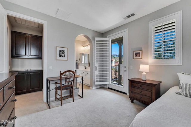 20752 Veneto Way, Porter Ranch, CA 91326 - bedroom with access to outside, light colored carpet, arched walkways, and connected bathroom