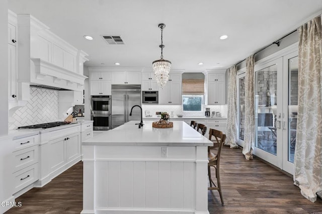 20752 Veneto Way, Porter Ranch, CA 91326 - kitchen featuring appliances with stainless steel finishes, tasteful backsplash, dark wood-type flooring, and recessed lighting
