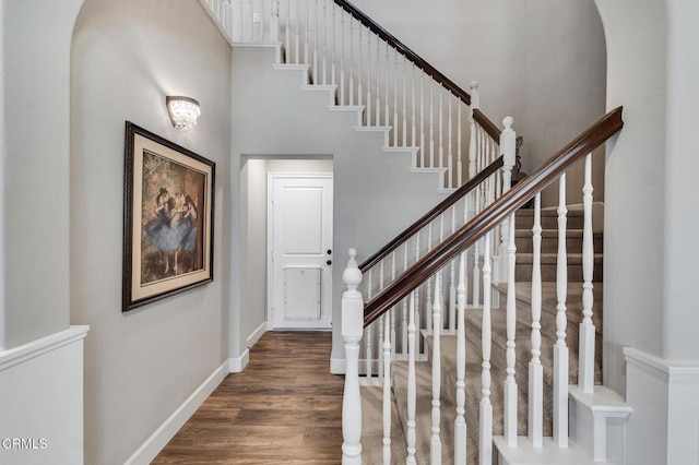 20752 Veneto Way, Porter Ranch, CA 91326 - stairway featuring a high ceiling and wood finished floors