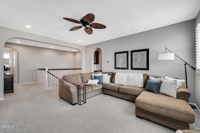 20752 Veneto Way, Porter Ranch, CA 91326 - living room with arched walkways, light carpet, ceiling fan, and recessed lighting