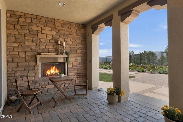 20752 Veneto Way, Porter Ranch, CA 91326 - view of patio featuring an outdoor stone fireplace