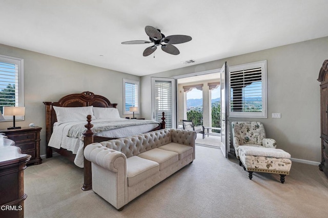 20752 Veneto Way, Porter Ranch, CA 91326 - bedroom featuring access to exterior, light carpet, multiple windows, and a ceiling fan