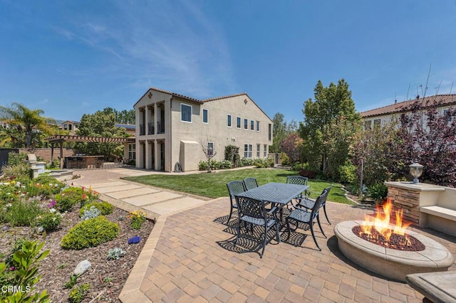 20752 Veneto Way, Porter Ranch, CA 91326 - view of patio with a fire pit, outdoor dining space, and a pergola