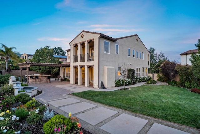 20752 Veneto Way, Porter Ranch, CA 91326 - back of property with a patio area, stucco siding, a balcony, and a pergola