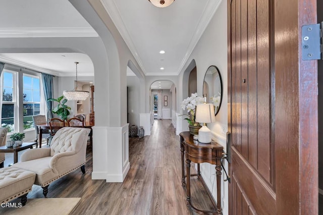20752 Veneto Way, Porter Ranch, CA 91326 - hallway featuring arched walkways, wood finished floors, ornamental molding, and recessed lighting