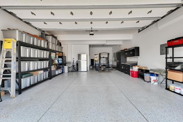 20752 Veneto Way, Porter Ranch, CA 91326 - garage with freestanding refrigerator and electric panel