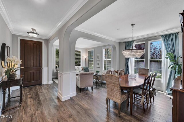 20752 Veneto Way, Porter Ranch, CA 91326 - dining space with dark wood-type flooring, arched walkways, plenty of natural light, and ornamental molding
