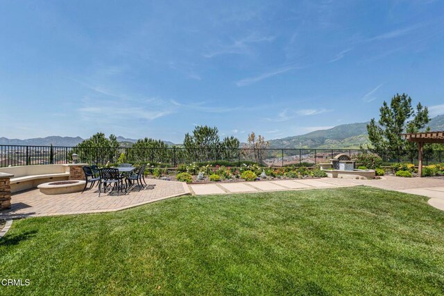 20752 Veneto Way, Porter Ranch, CA 91326 - view of yard with a fire pit, a mountain view, and a patio