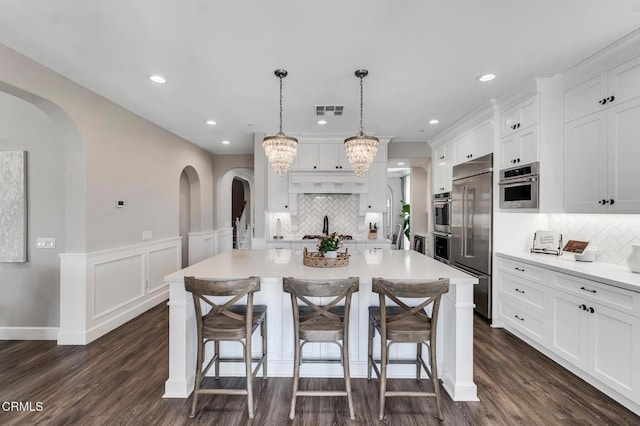 20752 Veneto Way, Porter Ranch, CA 91326 - kitchen featuring backsplash, stainless steel appliances, dark wood-type flooring, and recessed lighting