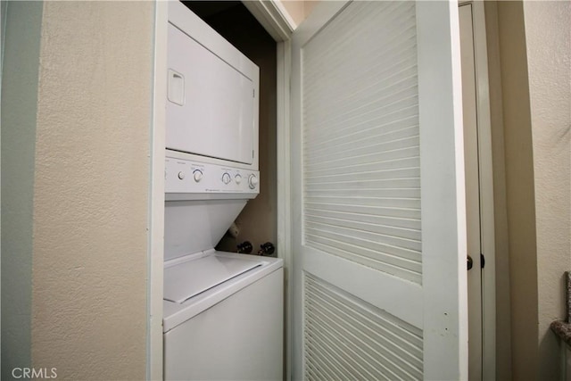 7312 Quill Dr Unit 13, Downey, CA 90242 - laundry area with stacked washer / dryer and a textured wall