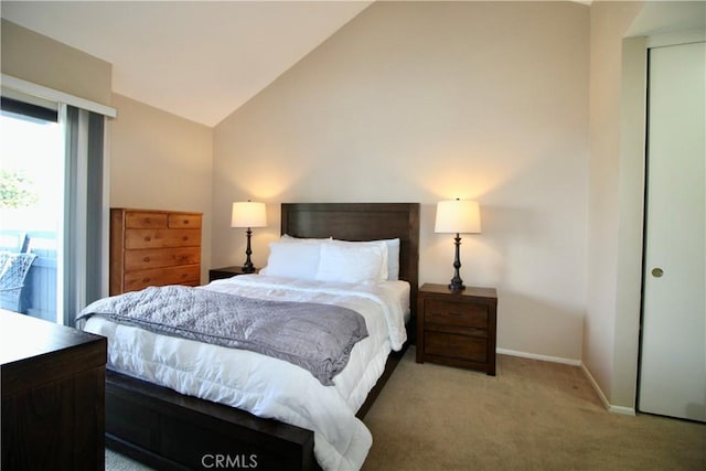 7312 Quill Dr Unit 13, Downey, CA 90242 - bedroom with lofted ceiling, carpet, and baseboards