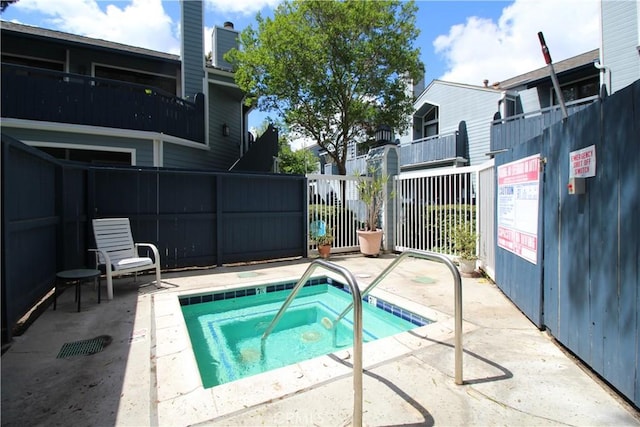 7312 Quill Dr Unit 13, Downey, CA 90242 - view of pool featuring fence and a community hot tub