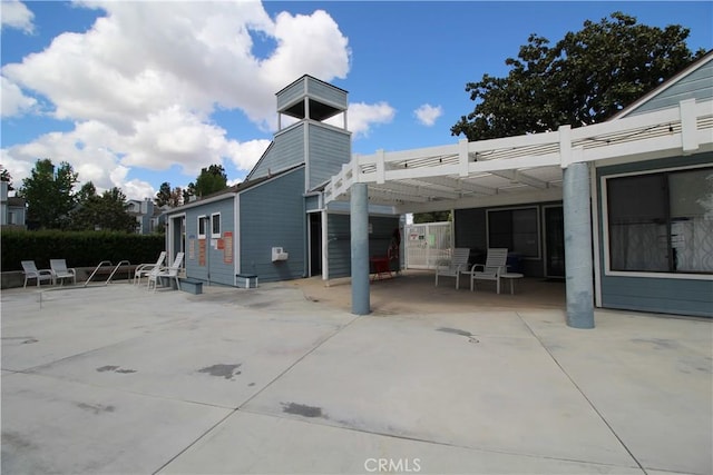 7312 Quill Dr Unit 13, Downey, CA 90242 - view of patio / terrace with a pergola and a carport