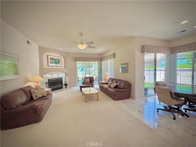 3025 Camino De Las Piedras, El Cajon, CA 92019 - living area featuring healthy amount of natural light, a fireplace with flush hearth, recessed lighting, ceiling fan, and a desk