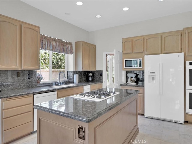 3025 Camino De Las Piedras, El Cajon, CA 92019 - kitchen with white appliances, light brown cabinetry, dark stone counters, tasteful backsplash, and a center island
