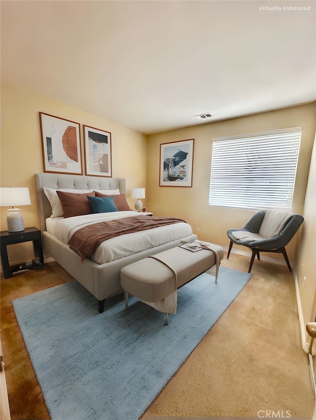 bedroom with baseboards and visible vents