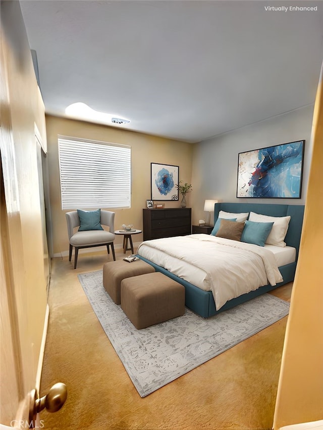 carpeted bedroom with baseboards
