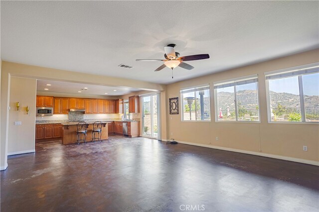 22939 Montanya Pl, Murrieta, CA 92562 - living room featuring baseboards, a ceiling fan, finished concrete floors, and recessed lighting