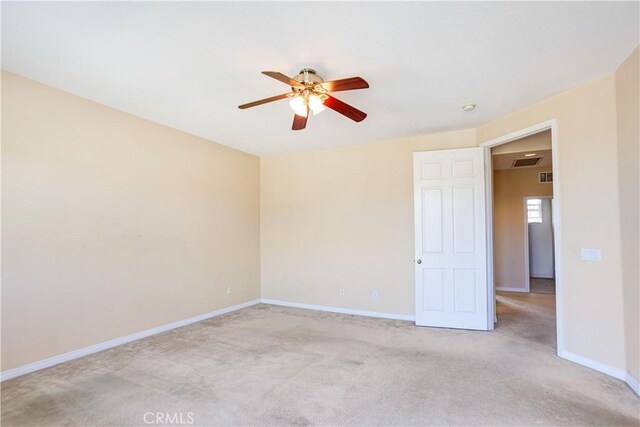 22939 Montanya Pl, Murrieta, CA 92562 - spare room featuring ceiling fan, light colored carpet, and baseboards