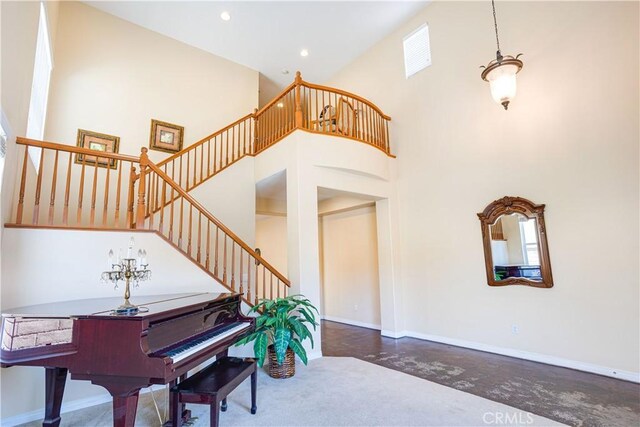 22939 Montanya Pl, Murrieta, CA 92562 - entryway with stairs, baseboards, a high ceiling, finished concrete flooring, and recessed lighting