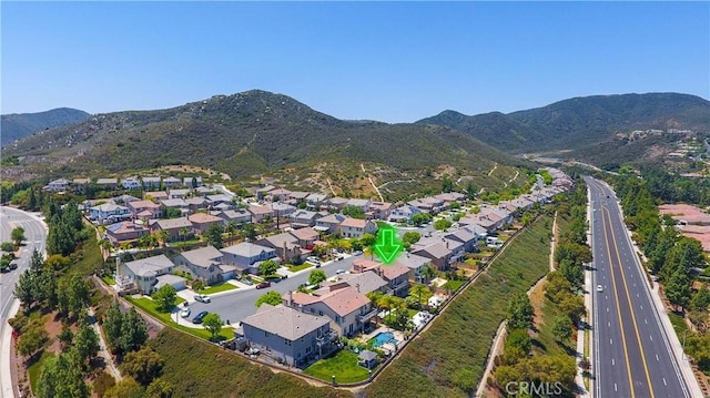 22939 Montanya Pl, Murrieta, CA 92562 - aerial view of property's location featuring nearby suburban area, a mountainous background, and a major roadway