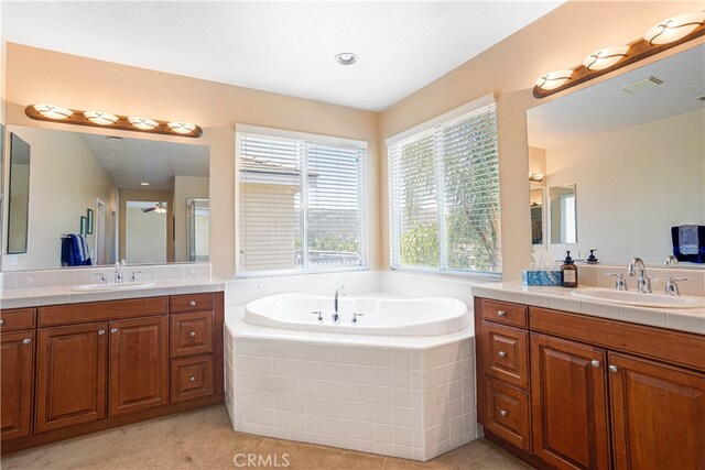 22939 Montanya Pl, Murrieta, CA 92562 - full bathroom featuring two vanities and a bath