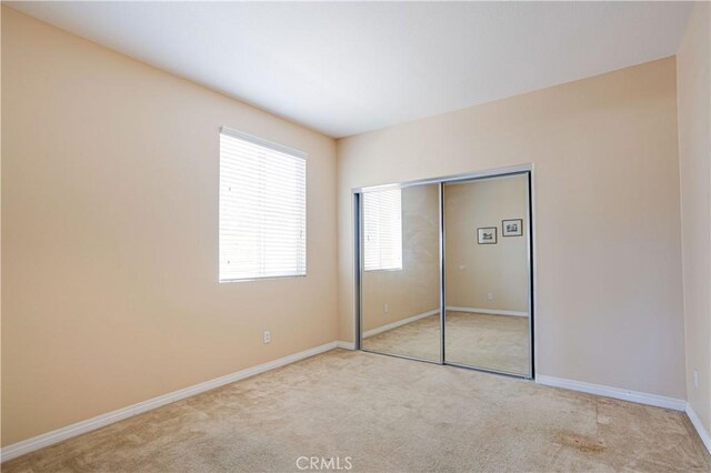 22939 Montanya Pl, Murrieta, CA 92562 - unfurnished bedroom featuring carpet floors, baseboards, and a closet