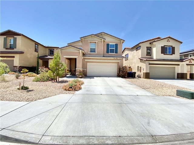 traditional-style house featuring central AC unit, stucco siding, concrete driveway, and an attached garage