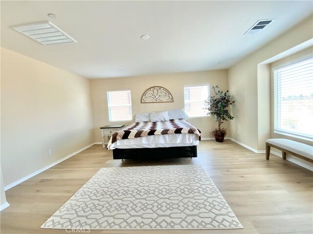 12952 Claremore St, Victorville, CA 92392 - bedroom with multiple windows and light wood-style flooring