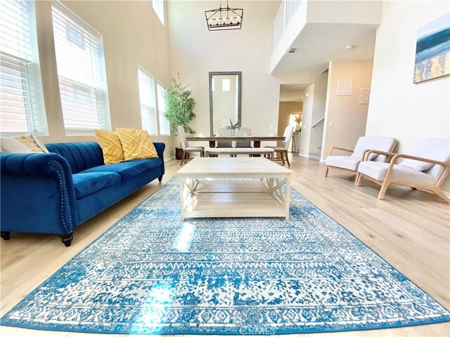 12952 Claremore St, Victorville, CA 92392 - living area with wood finished floors and a towering ceiling