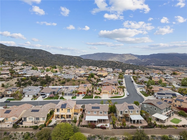 drone / aerial view featuring a residential view and a mountain view