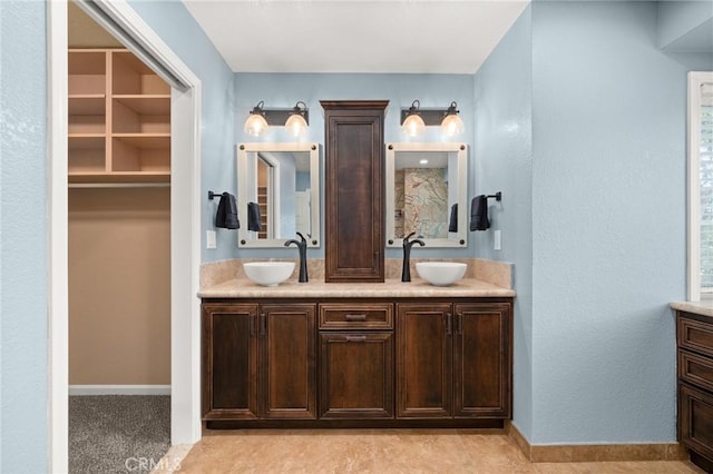 9334 Shamouti Dr, Riverside, CA 92508 - full bath featuring double vanity and baseboards