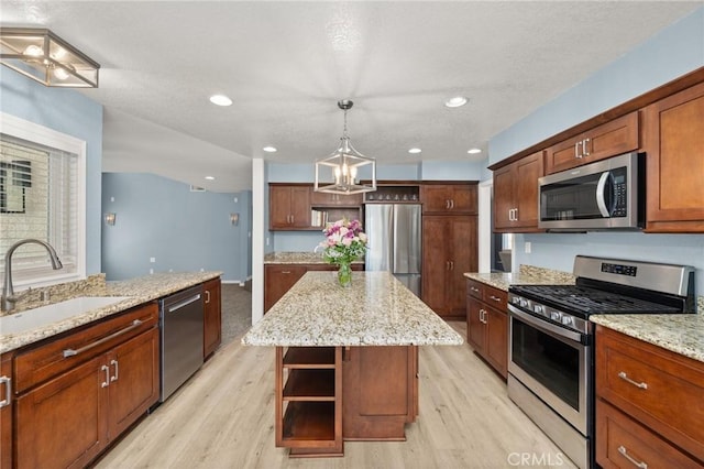 9334 Shamouti Dr, Riverside, CA 92508 - kitchen with stainless steel appliances, a sink, open shelves, light wood finished floors, and recessed lighting