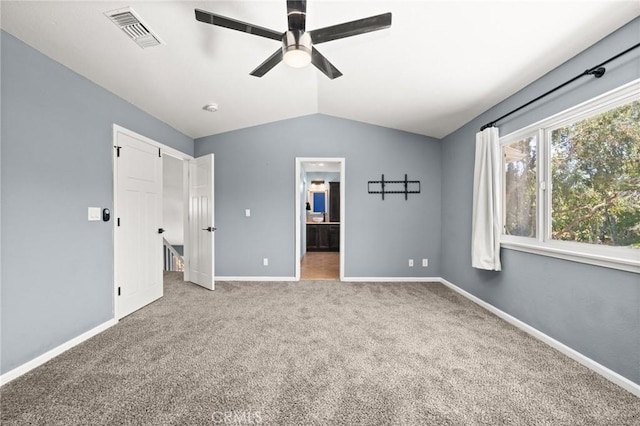 9334 Shamouti Dr, Riverside, CA 92508 - unfurnished bedroom featuring vaulted ceiling, carpet floors, baseboards, connected bathroom, and ceiling fan