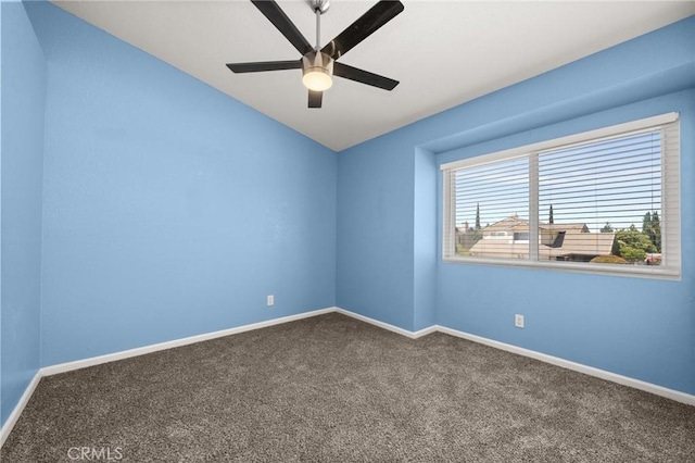 9334 Shamouti Dr, Riverside, CA 92508 - empty room featuring dark carpet, a ceiling fan, baseboards, and lofted ceiling