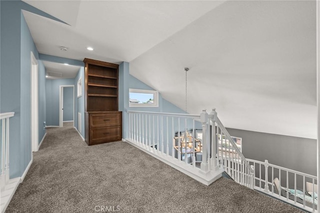 9334 Shamouti Dr, Riverside, CA 92508 - hallway with carpet floors, lofted ceiling, and baseboards