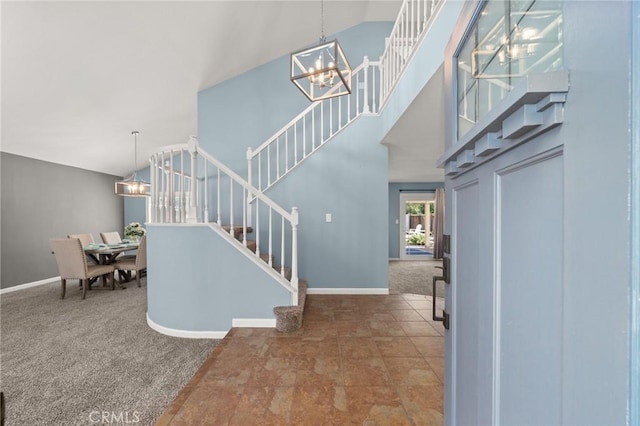 9334 Shamouti Dr, Riverside, CA 92508 - entryway with a chandelier, stairway, carpet flooring, baseboards, and a high ceiling