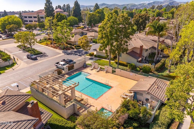 aerial view featuring a mountain view and a residential view