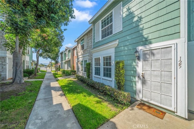 view of property exterior with a residential view